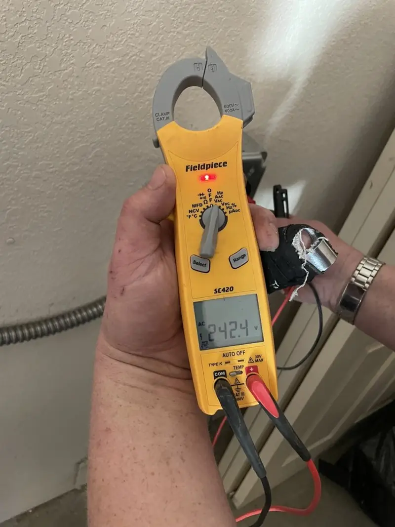 Voltage testing with clamp meter during Circuit Breaker Repair in Fridley